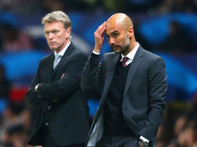 David Moyes (left) and Pep Guardiola look on from the touchline at Old Trafford
