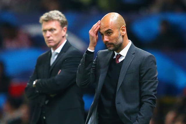 David Moyes (left) and Pep Guardiola look on from the touchline at Old Trafford