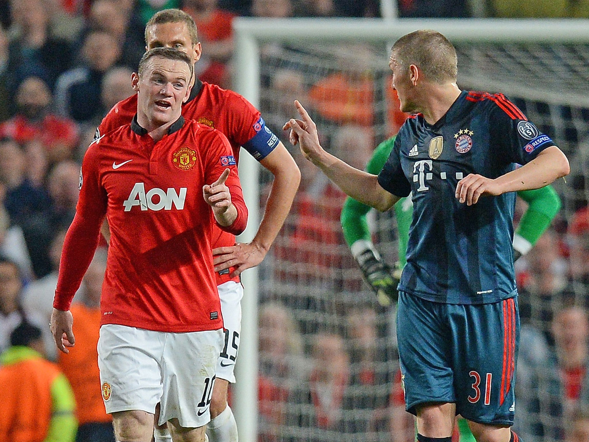 Wayne Rooney and Bastian Schweinsteiger wag fingers at one another following the German midfielder's sending off