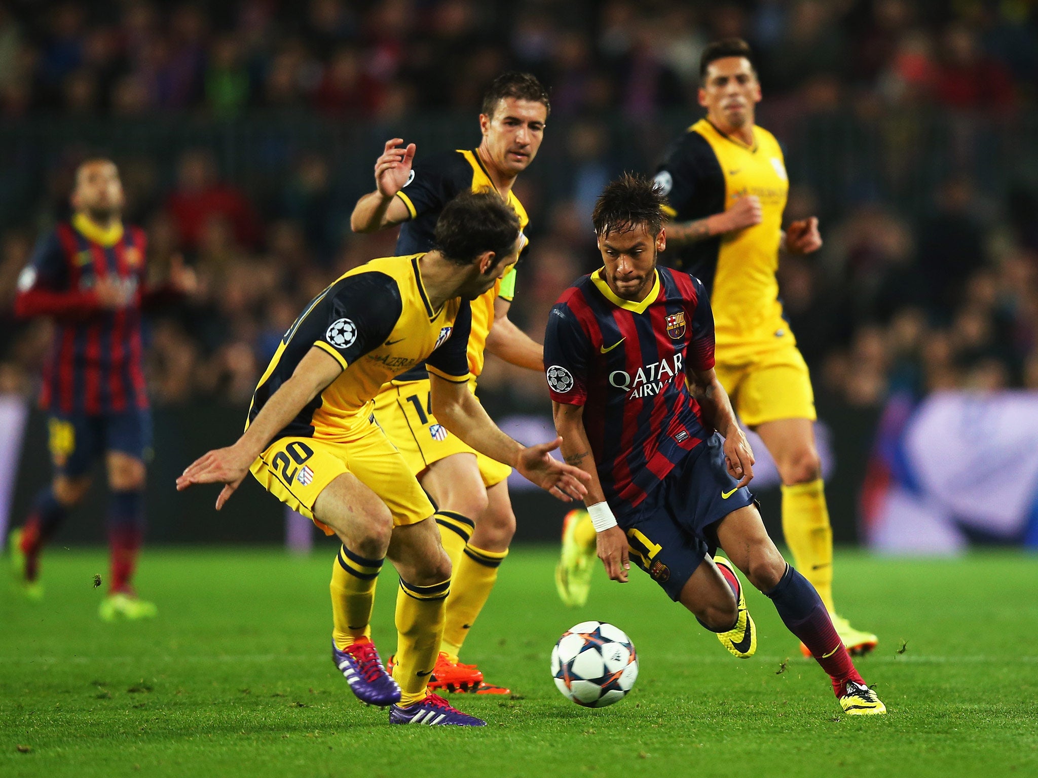 Neymar of Barcelona takes on Juanfran of Club Atletico de Madrid during the UEFA Champions League Quarter Final first leg
