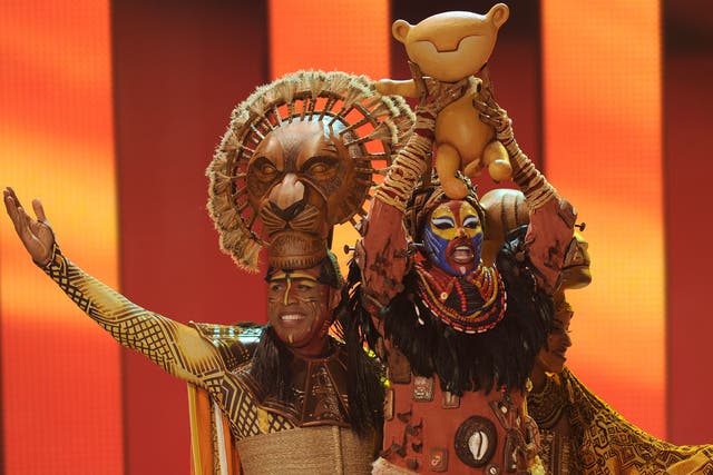 Actors from The Lion King musical perform on-stage