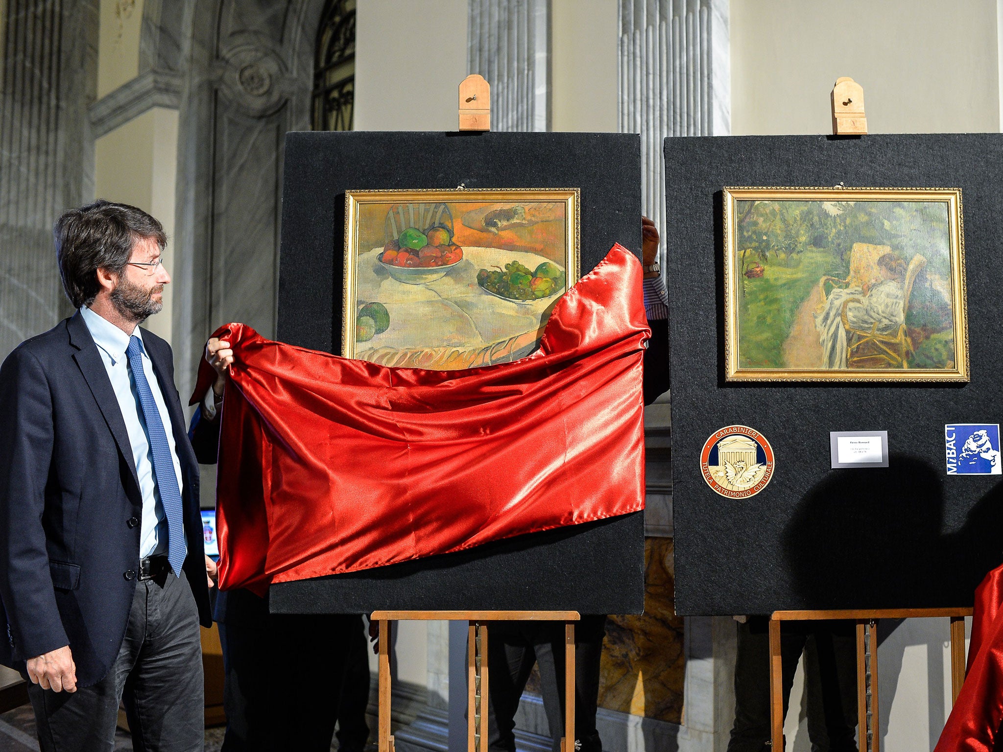 Italian minister of culture Dario Franceschini and General of Carabinieri Mariano Mossa unveil the two paintings stolen in London in the 1970s by French artists Paul Gauguin (left) and Pierre Bonnard (right)