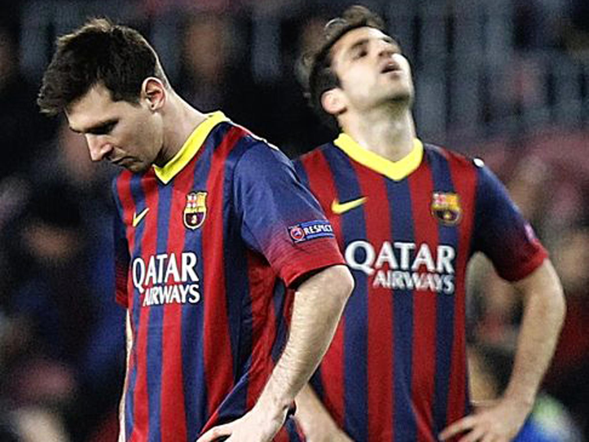 Lionel Messi and Cesc Fabregas hang their heads during Barcelona’s draw against Atletico Madrid