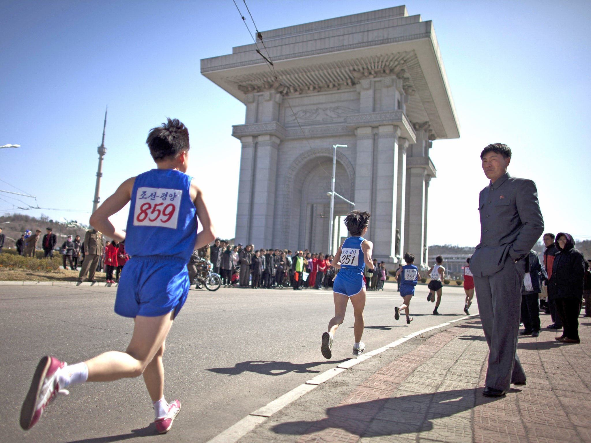 Runners approach the Arch of Triumph in Pyongyang during last year's marathon