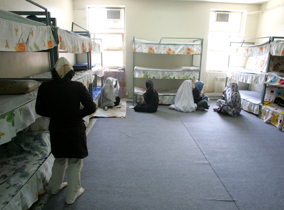 Iranian inmates in their cells at Evin jail