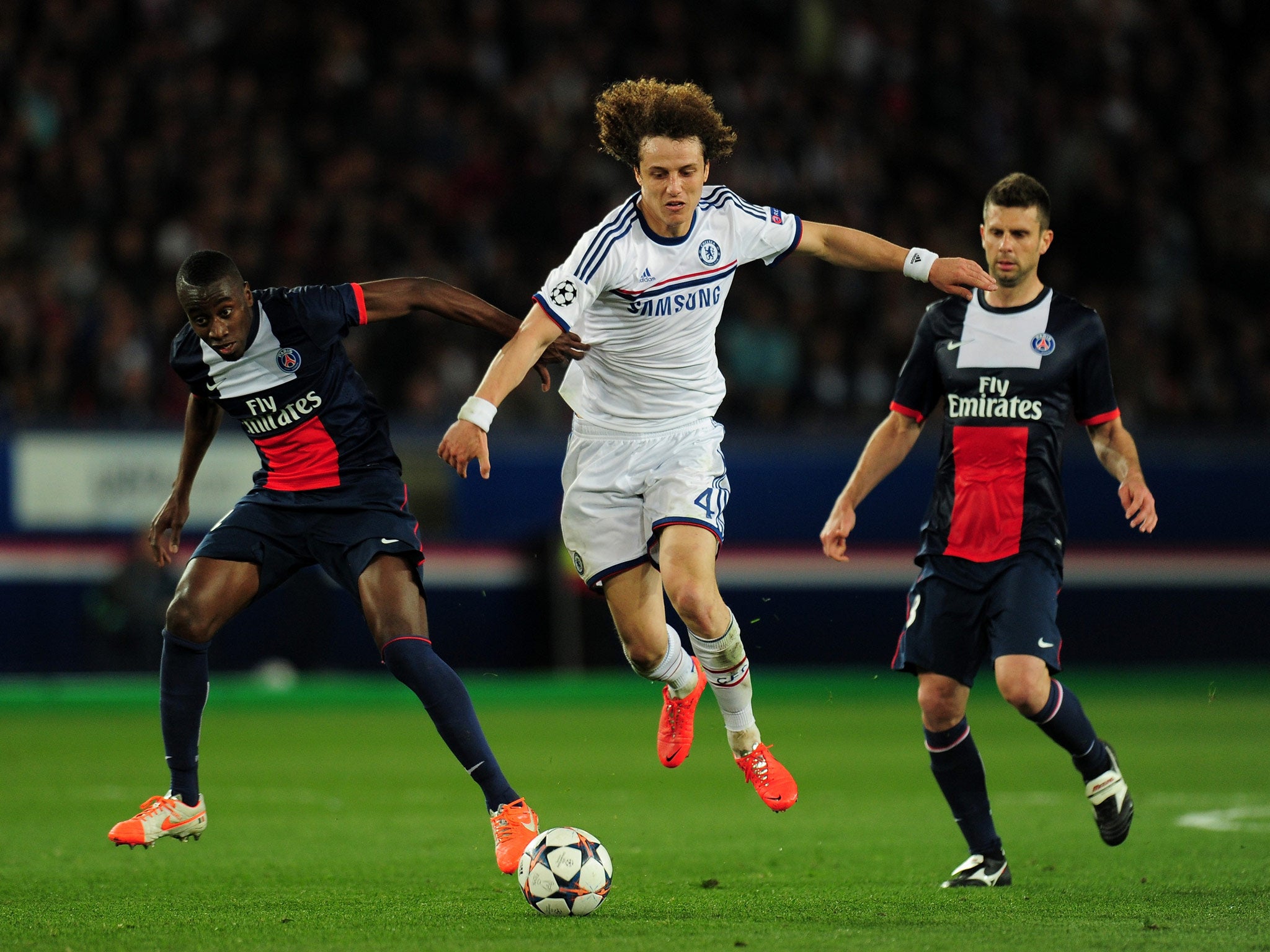 Thiago Motta and Blaise Matuidi of PSG vie for the ball with David Luiz of Chelsea