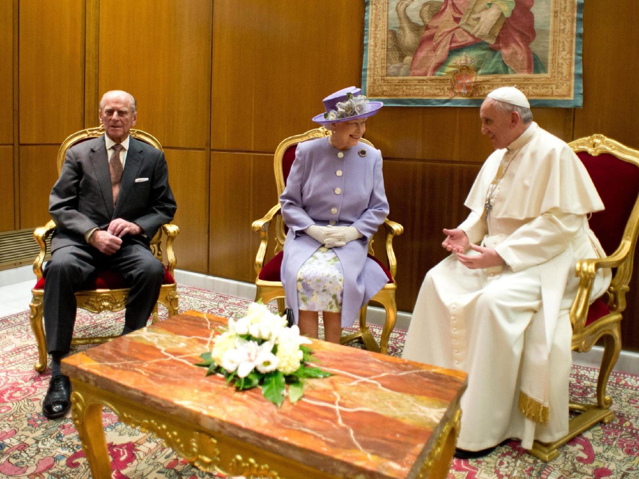 Britain's Queen Elizabeth II,87, talks to 77 year old Pope Francis during a meeting at the Vatican