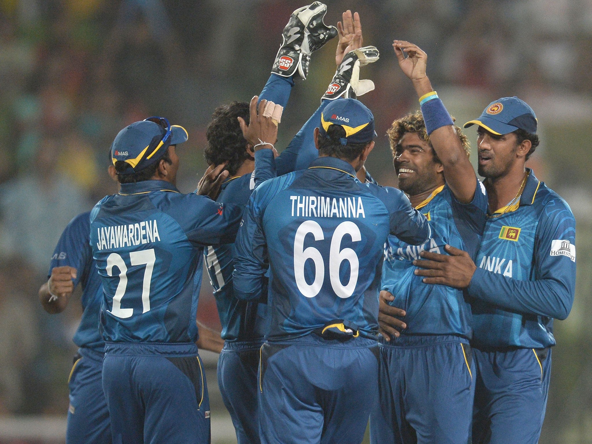 Lasith Malinga (second from right) celebrates the wicket of Chris Gayle