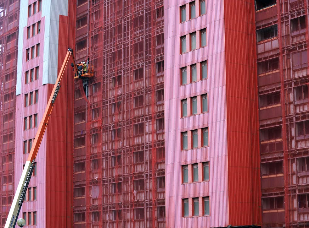 Workers inspect one of the 30-storey Red Road residential blocks in north Glasgow 