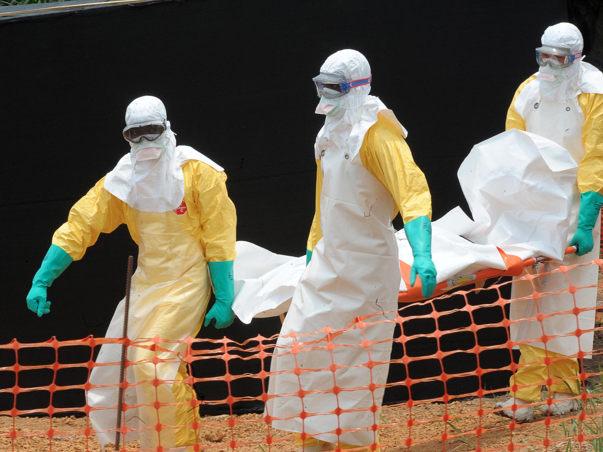 Médecins sans Frontières staff carry an Ebola victim’s body in Guinea this week