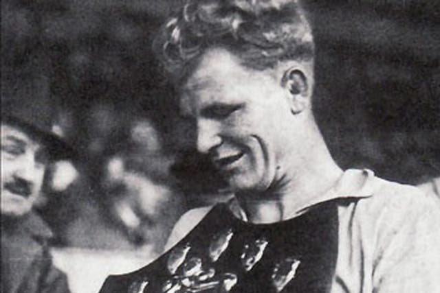 Fred Stansfield takes the trophy for Cardiff City’s Third Division
(South) title in 1947