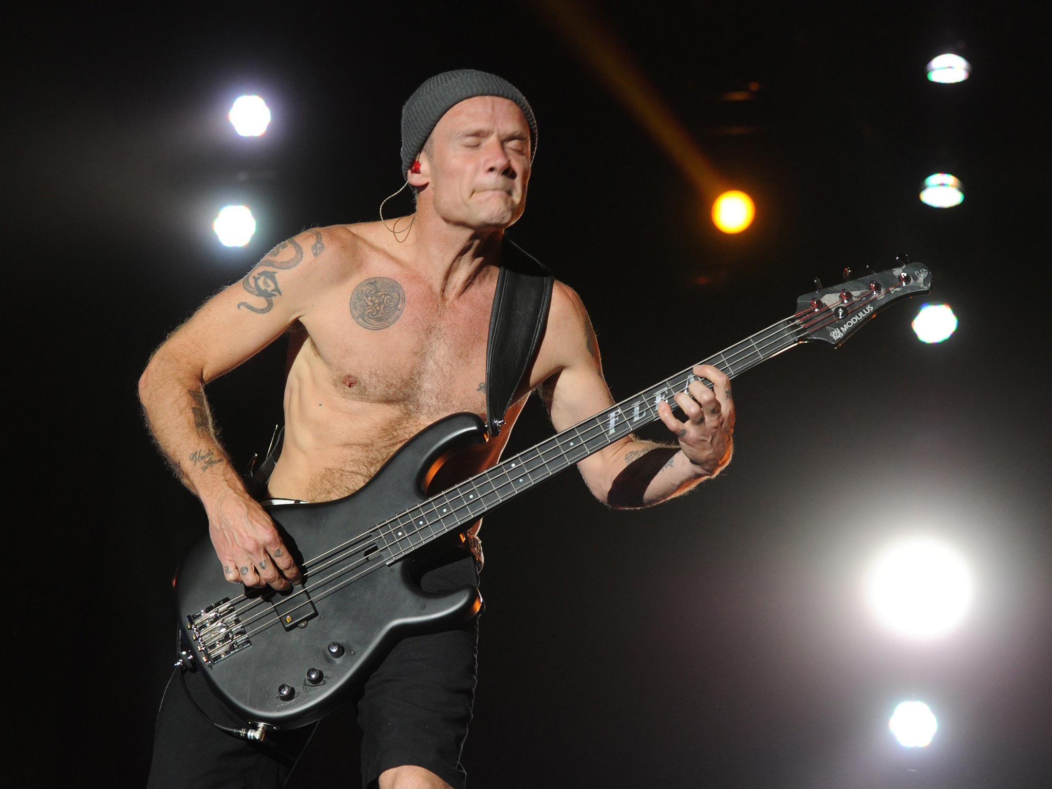 Musician Michael "Flea" Balzary of the band Red Hot Chili Peppers performs