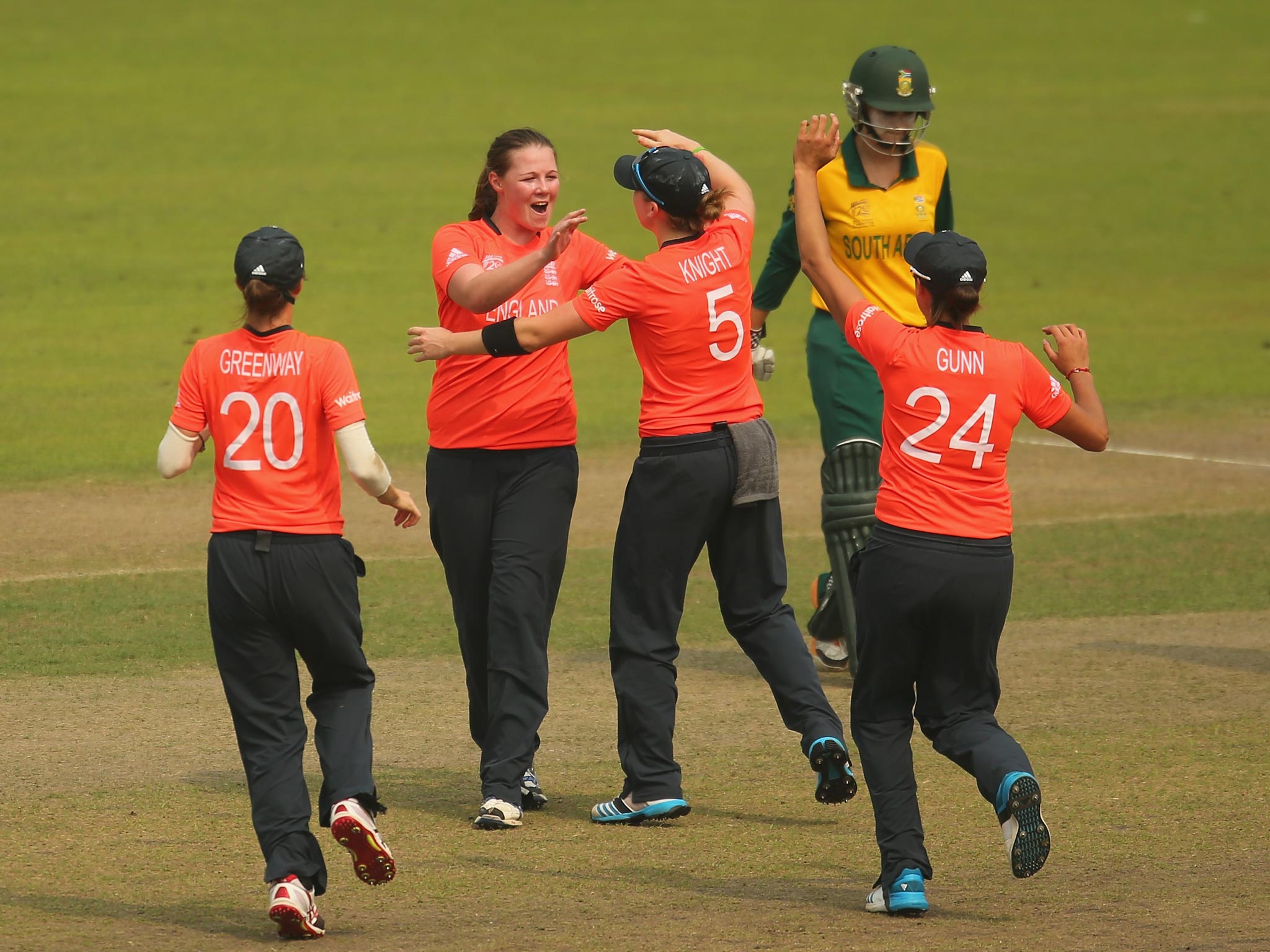Anya Shrubsole (second left) is congratulated after claiming the wicket of South Africa’s Trisha Chetty yesterday