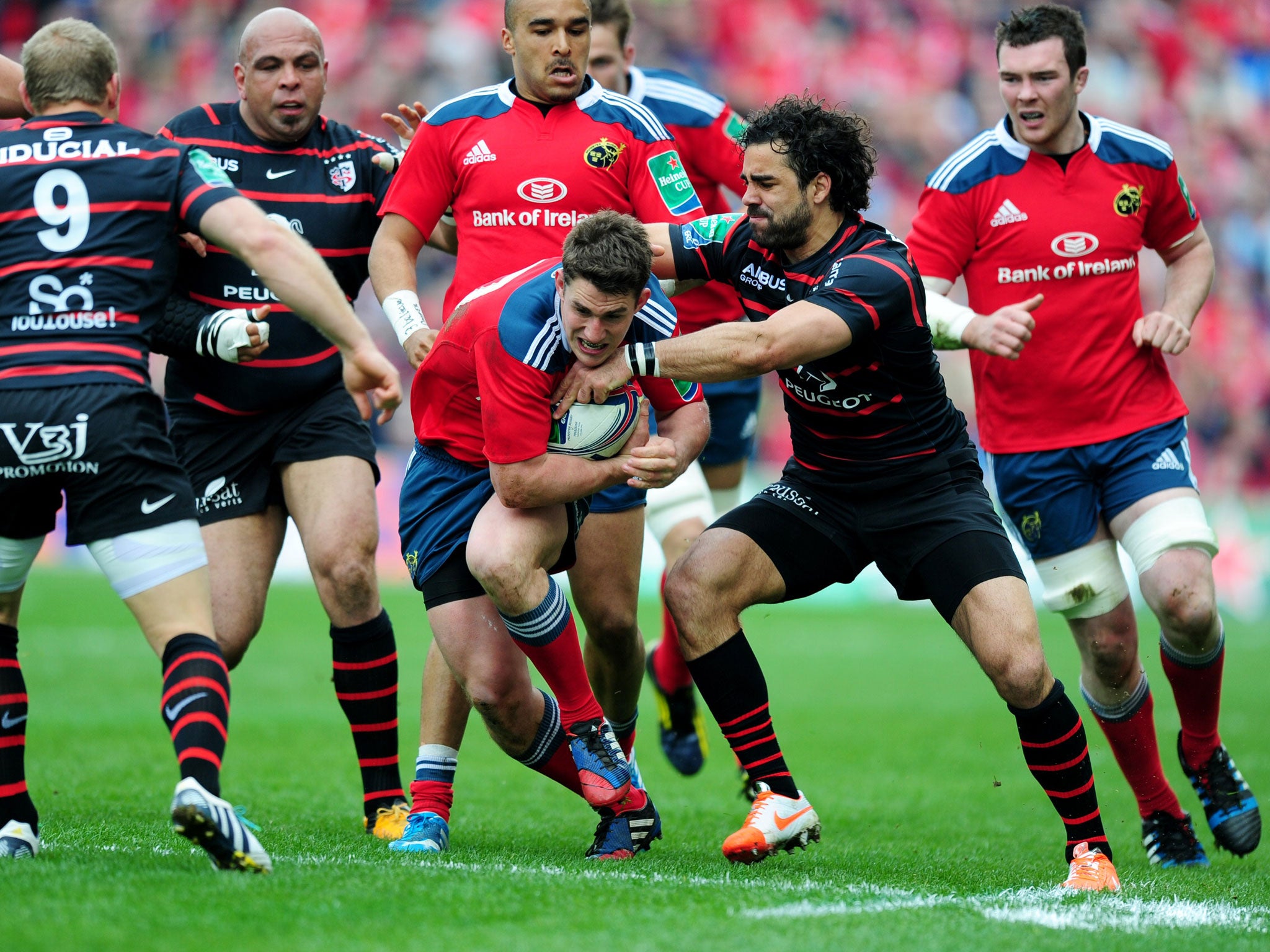 Ian Kealtey breaks through a tackle during Munster win