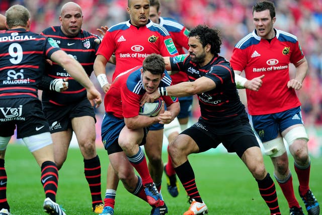 Ian Kealtey breaks through a tackle during Munster win