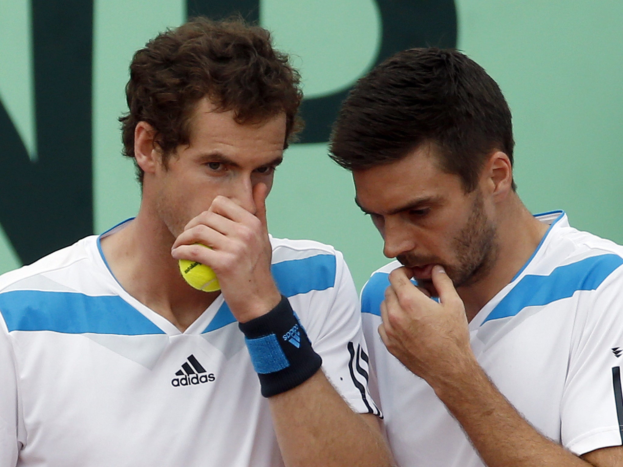 Andy Murray talks to Colin Fleming during the Davis Cup doubles against Italy