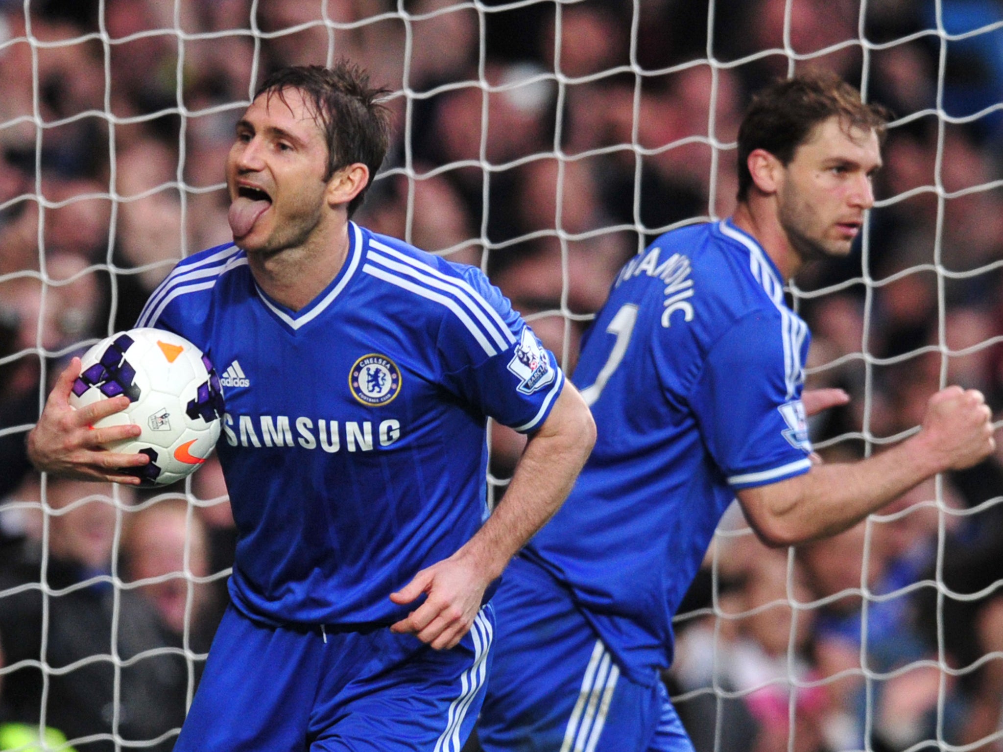 Frank Lampard celebrates after scoring the rebound from his saved penalty
