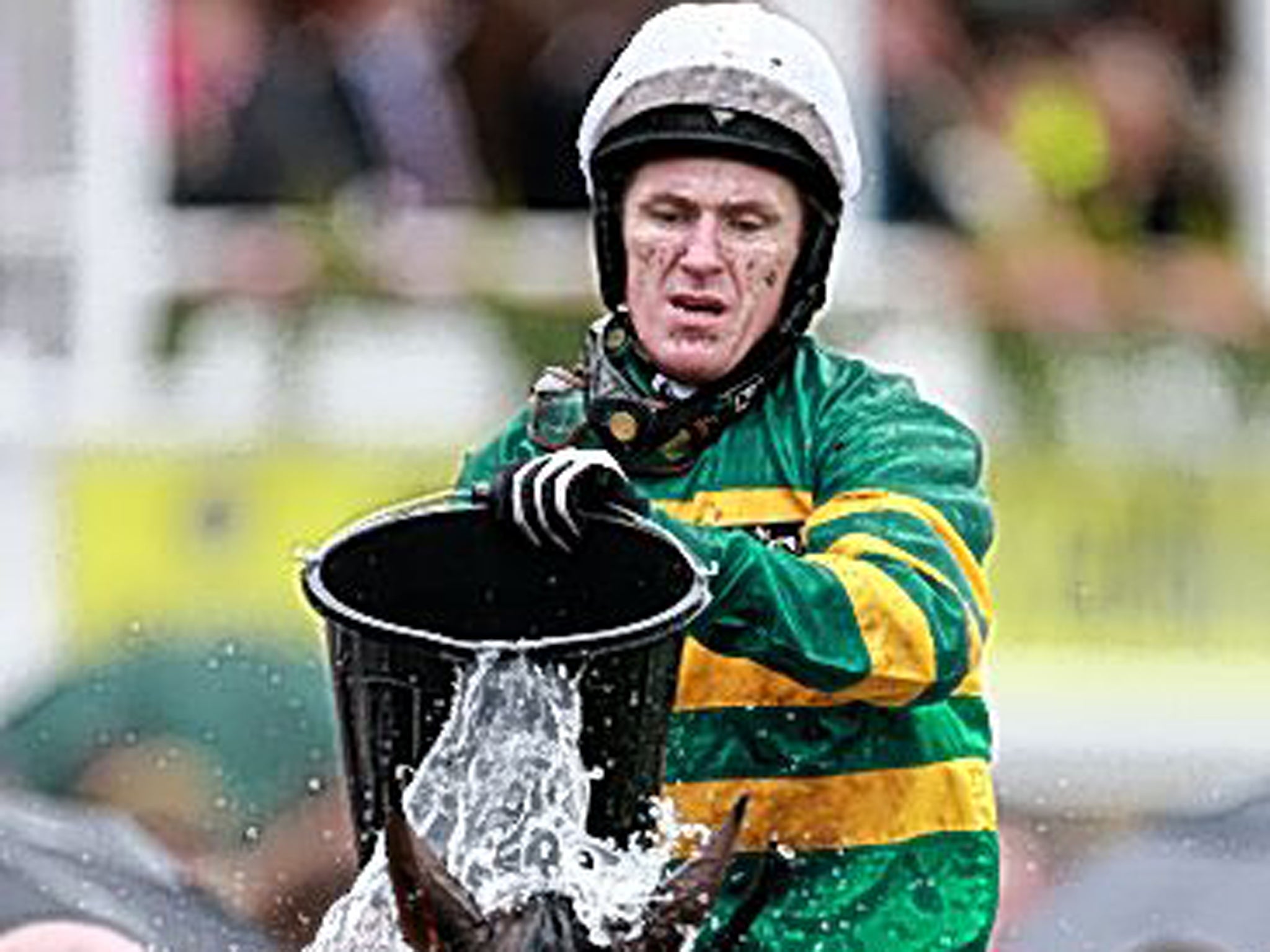 Making a splash: Tony McCoy cools off Double Seven after the race