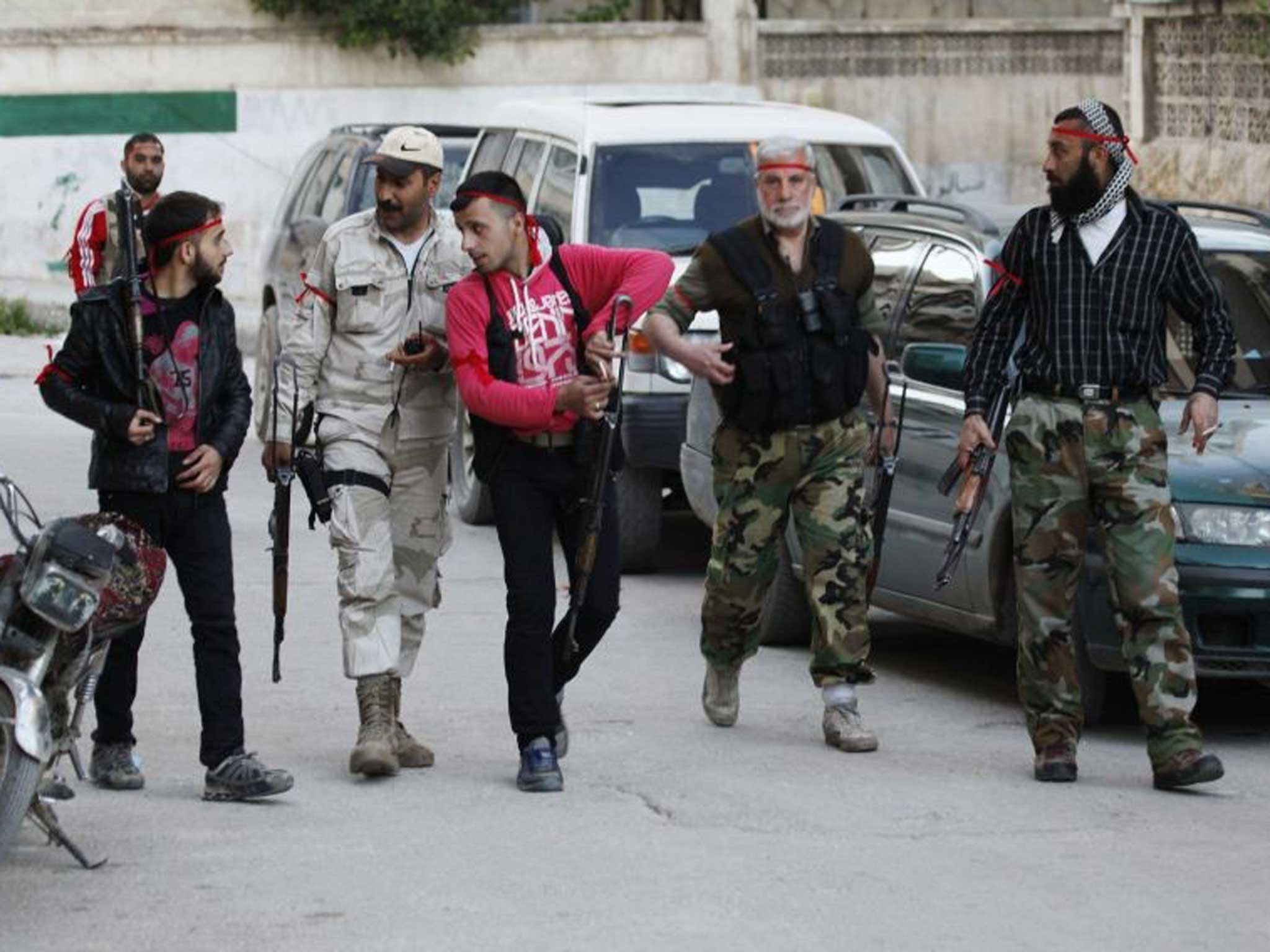 Rebel fighters in a suburb of Damascus during a brief ceasefire  