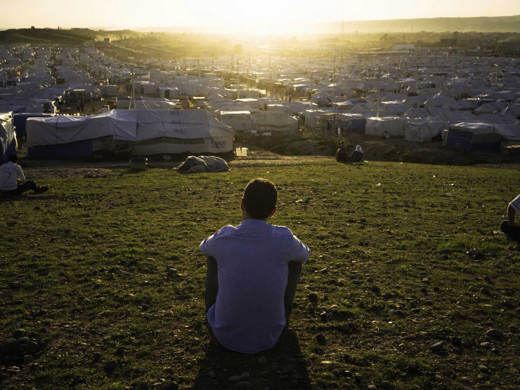 Khaled Hosseini looks over the camp