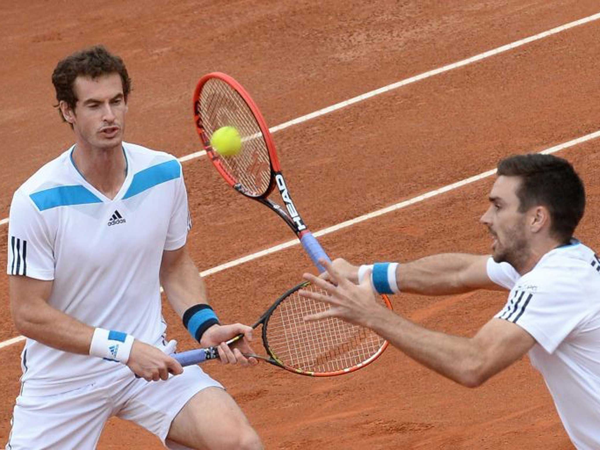 Lovely doubly: Andy Murray (left) and Colin Fleming on their way to a crucial Davis Cup victory for Britain in Italy