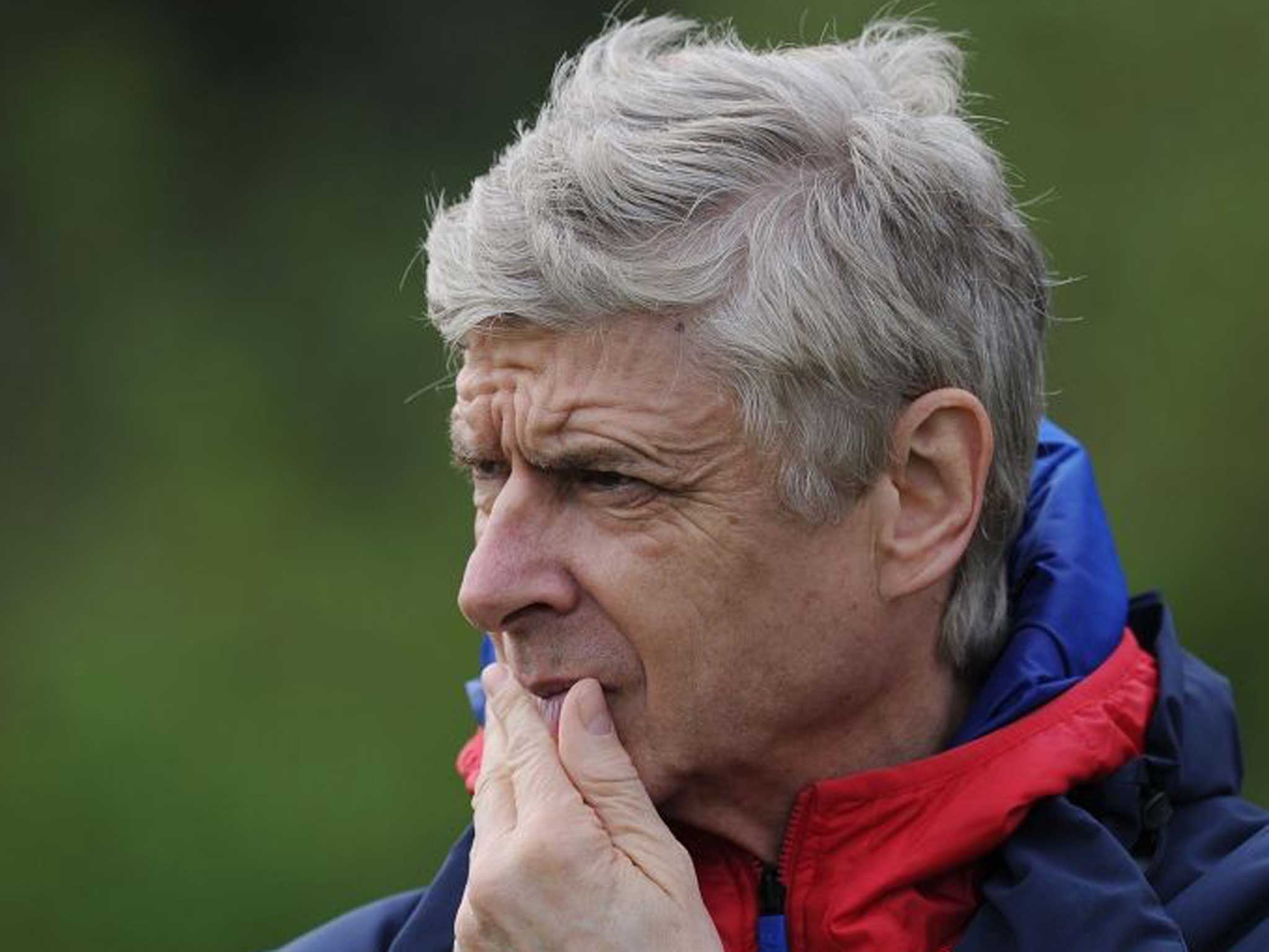 Wenger at a training session earlier this week: He has called for a review of the Premier League player loan system
