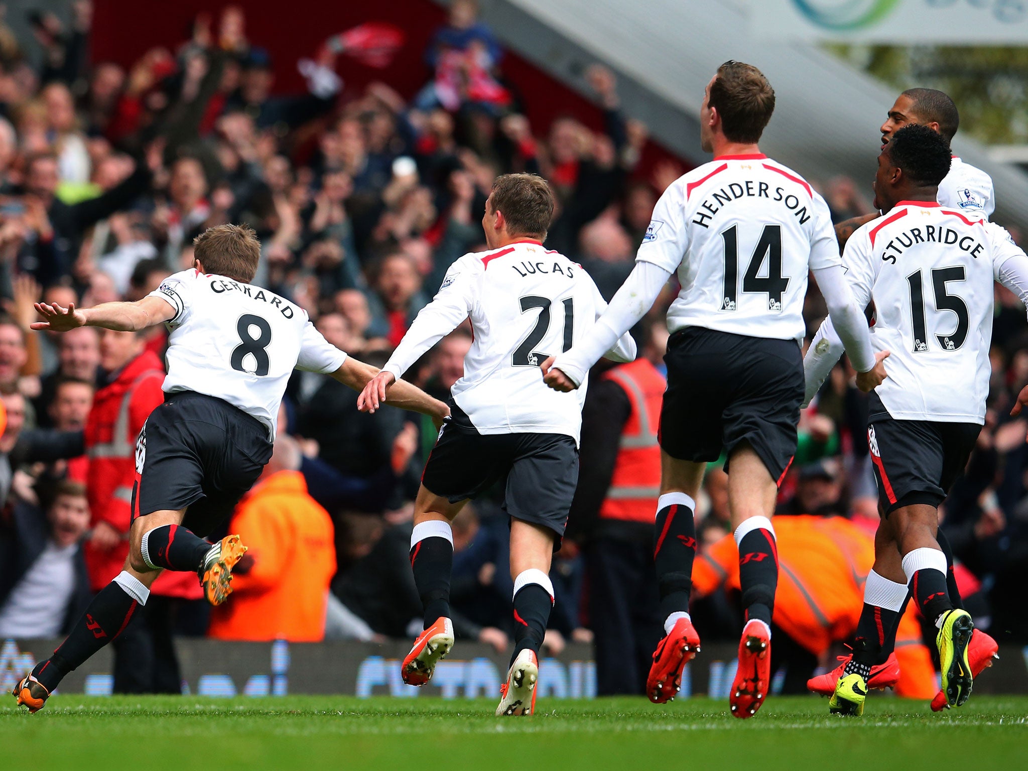 Steven Gerard leads Liverpool's celebration after scoring his second penalty