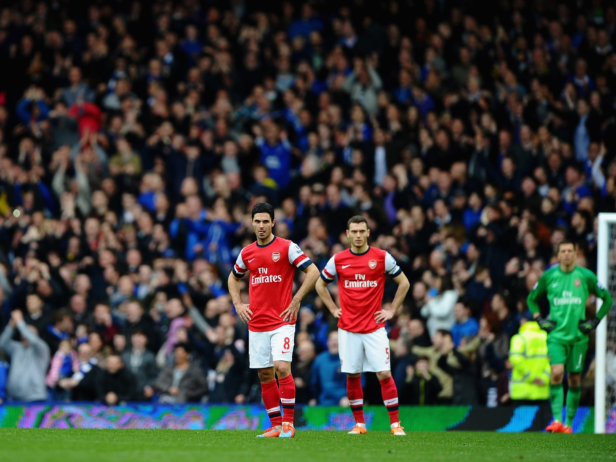 Mikel Arteta and Thomas Vermaelen look on after Everton score in the 3-0 win over Arsenal