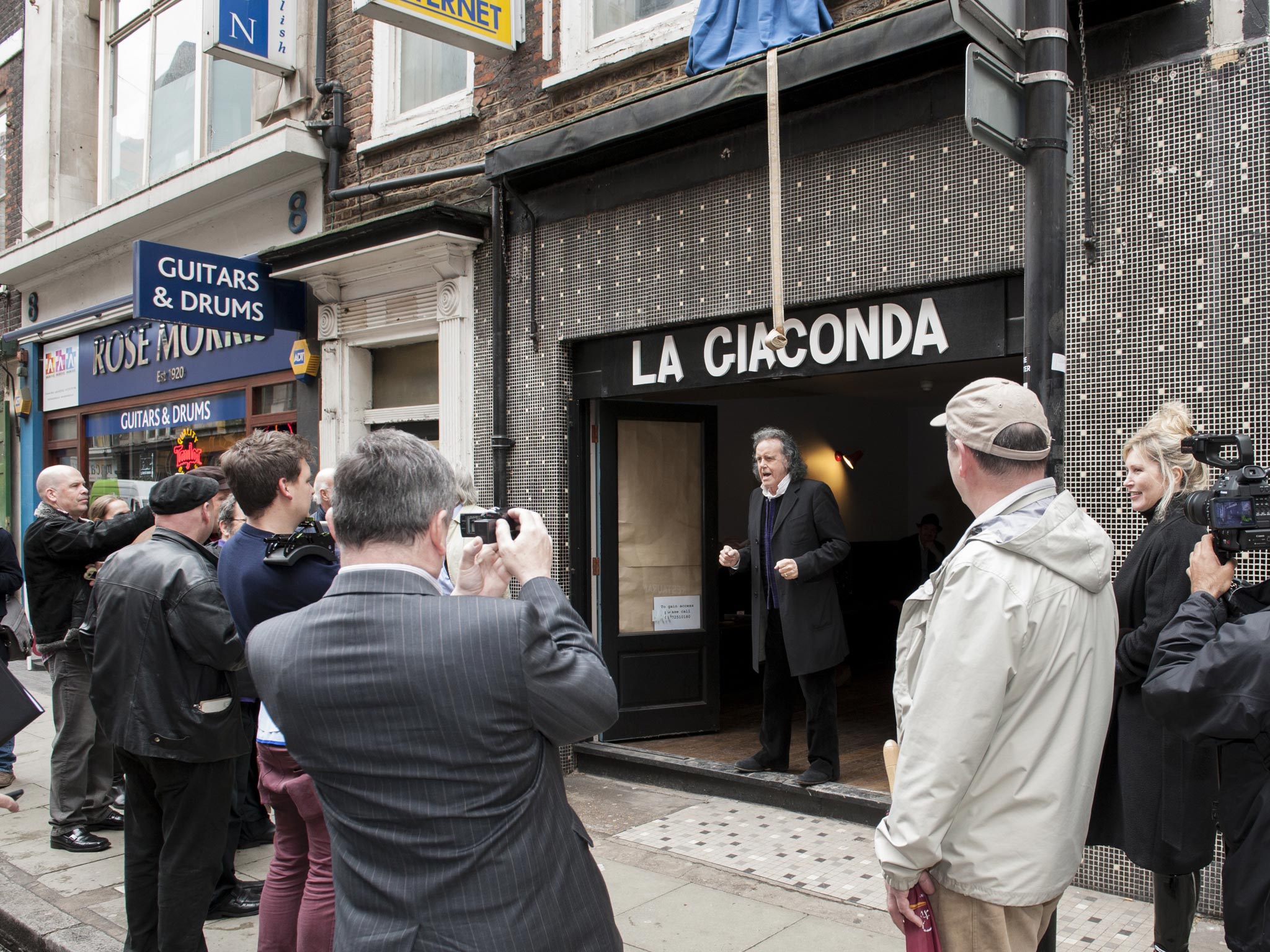 Donovan performs his new song, “Tin Pan Alley”, yesterday in Denmark Street, London, where a blue plaque was unveiled