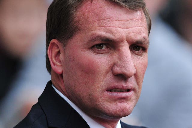 Liverpool manager Brendan Rodgers looks on from the touchline