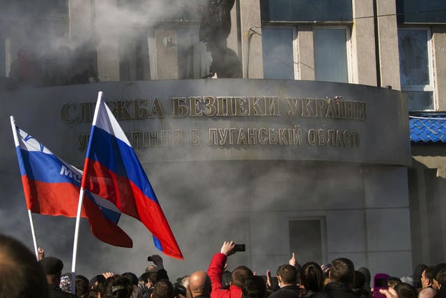 Pro-Russian activists hold a rally in front of Ukraine's regional security service of Ukraine in Lugansk