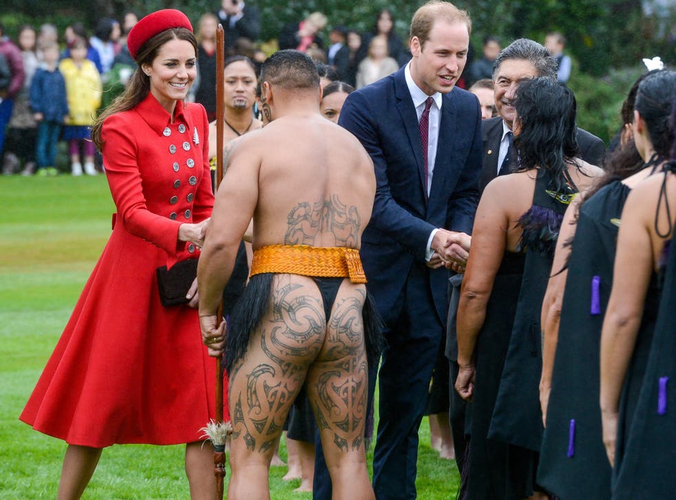 Prince William and Catherine Duchess of Cambridge talk with members of the Maori welcome group at an official welcome on the grounds of Government House in Wellington