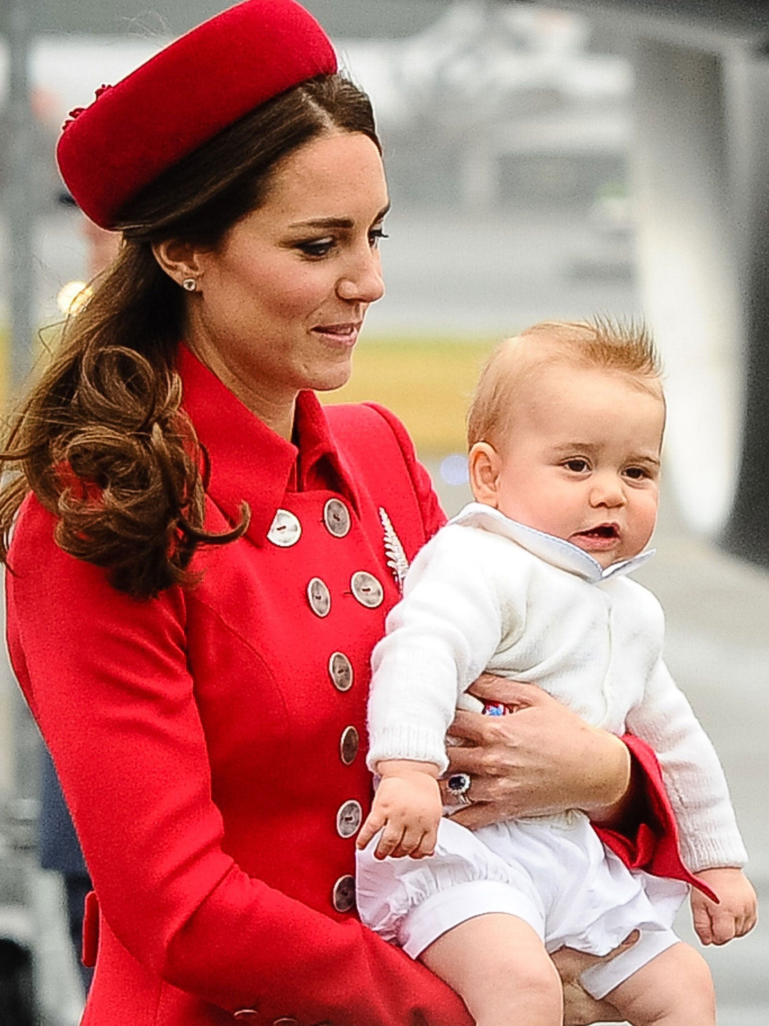 Catherine, the Duchess of Cambridge carries baby Prince George