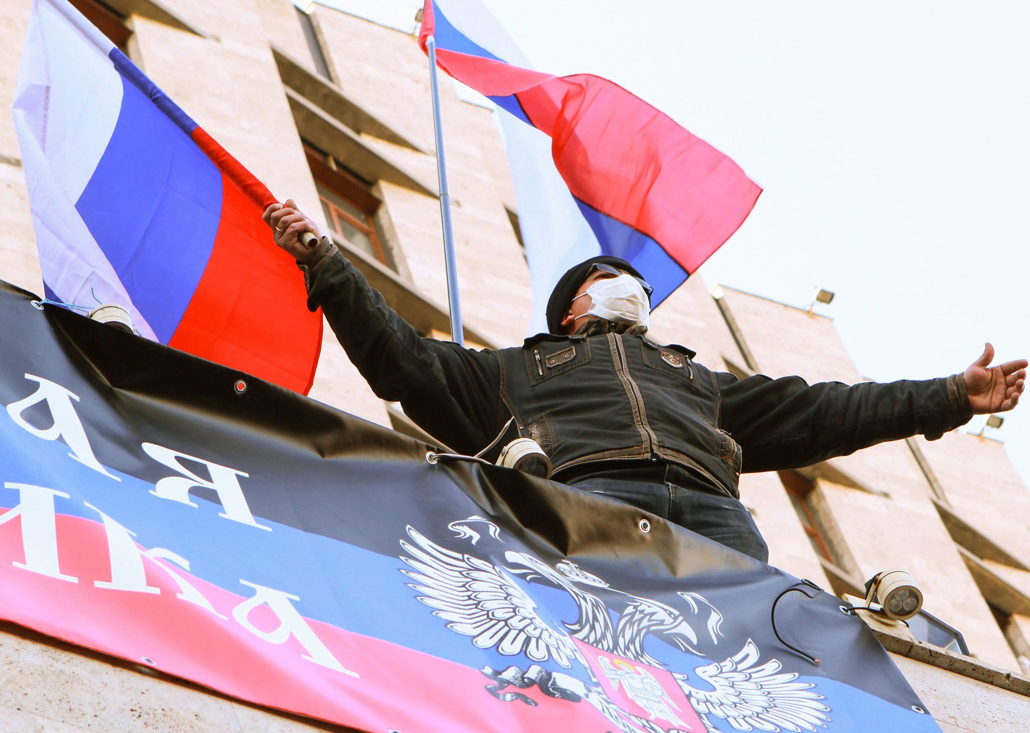 A pro-Russian protester gestures as he, along with others, occupied a regional administration building in Donetsk, Ukraine