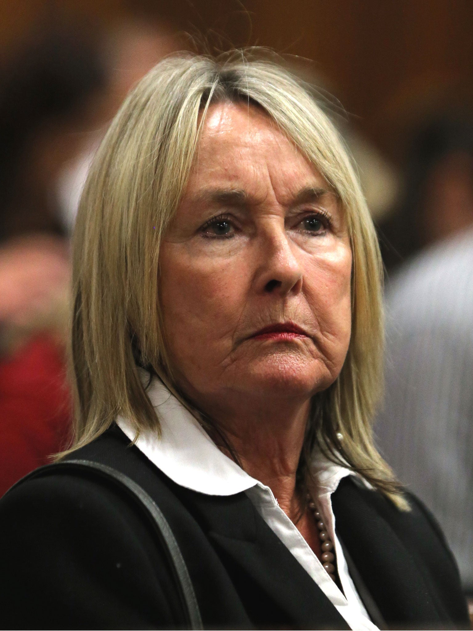 June Steenkamp, mother of the late Reeva Steenkamp listens to evidence by a pathologist during the murder trial of Oscar Pistorius in court in Pretoria
