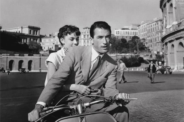 <p>Audrey Hepburn and Gregory Peck in ‘Roman Holiday’ in 1953 </p>