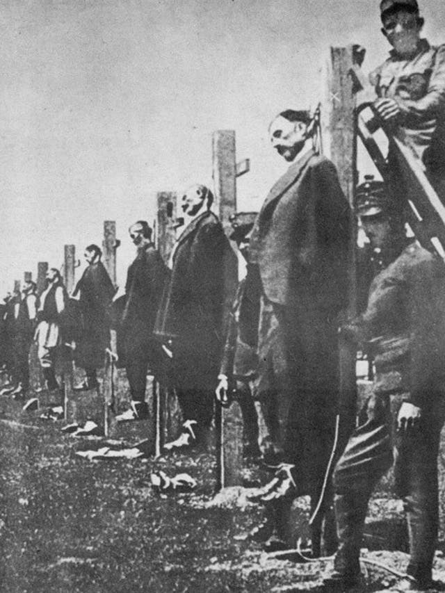Civilians near the Austrian lines in Serbia are strung up – probably
as a reprisal for guerrilla resistance to the invaders