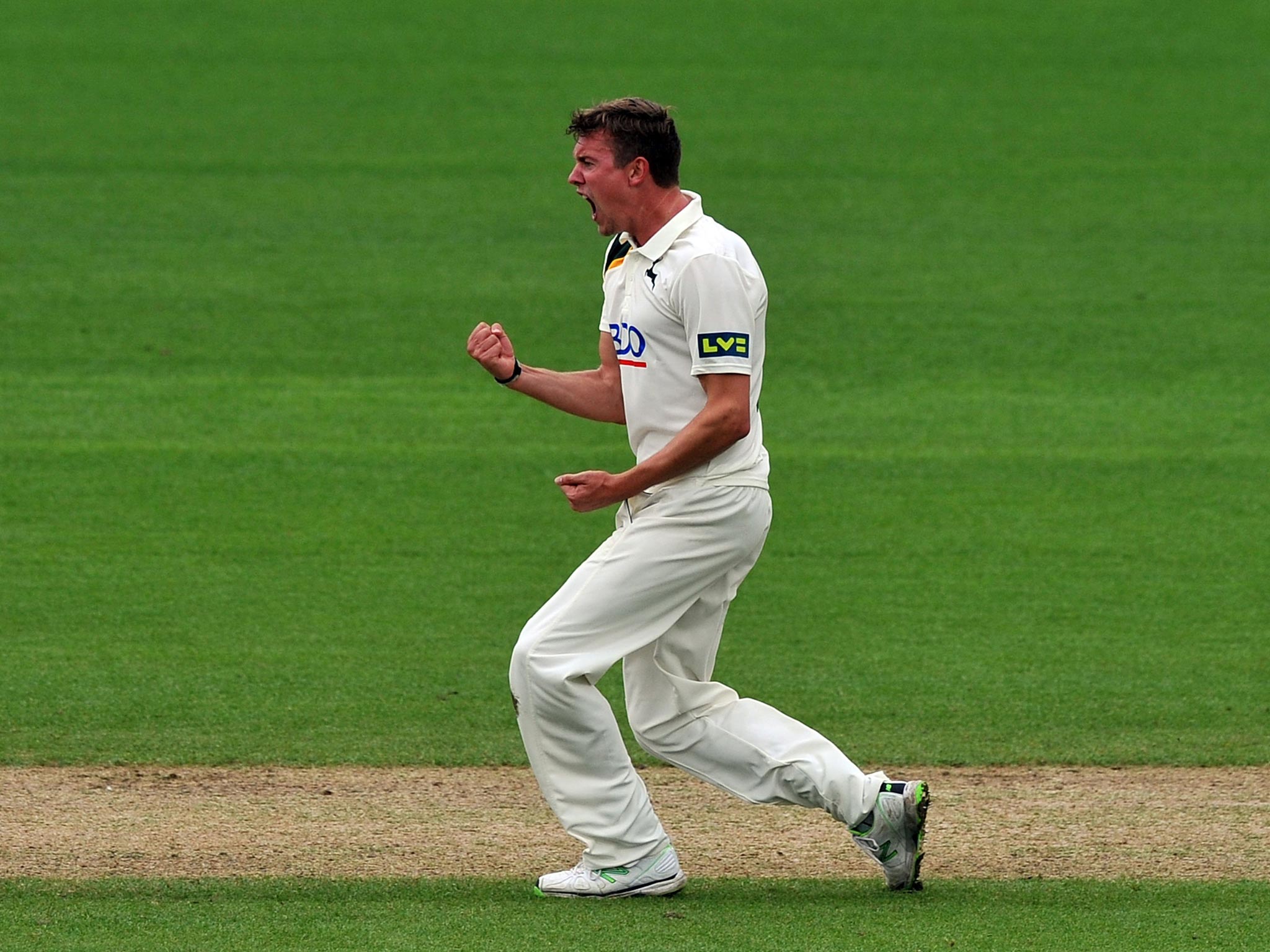 Nottinghamshire's Jake Ball celebrates taking the wicket of Lancashire's Luke Procter