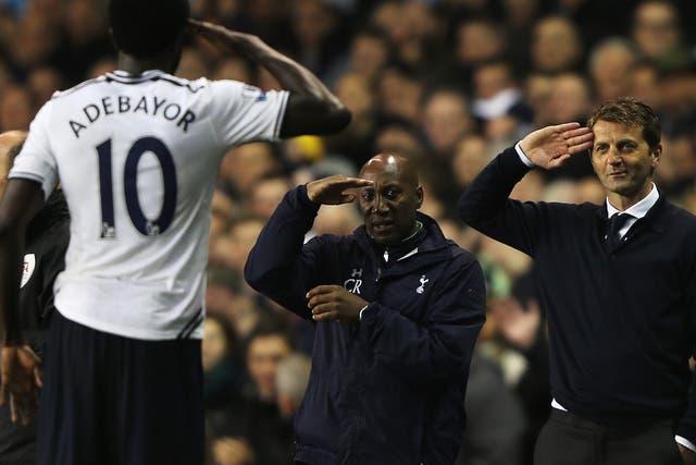 Emmanuel Adebayor of Tottenham Hotspur celebrates scoring his second goal against Sunderland by saluting manager Tim Sherwood 