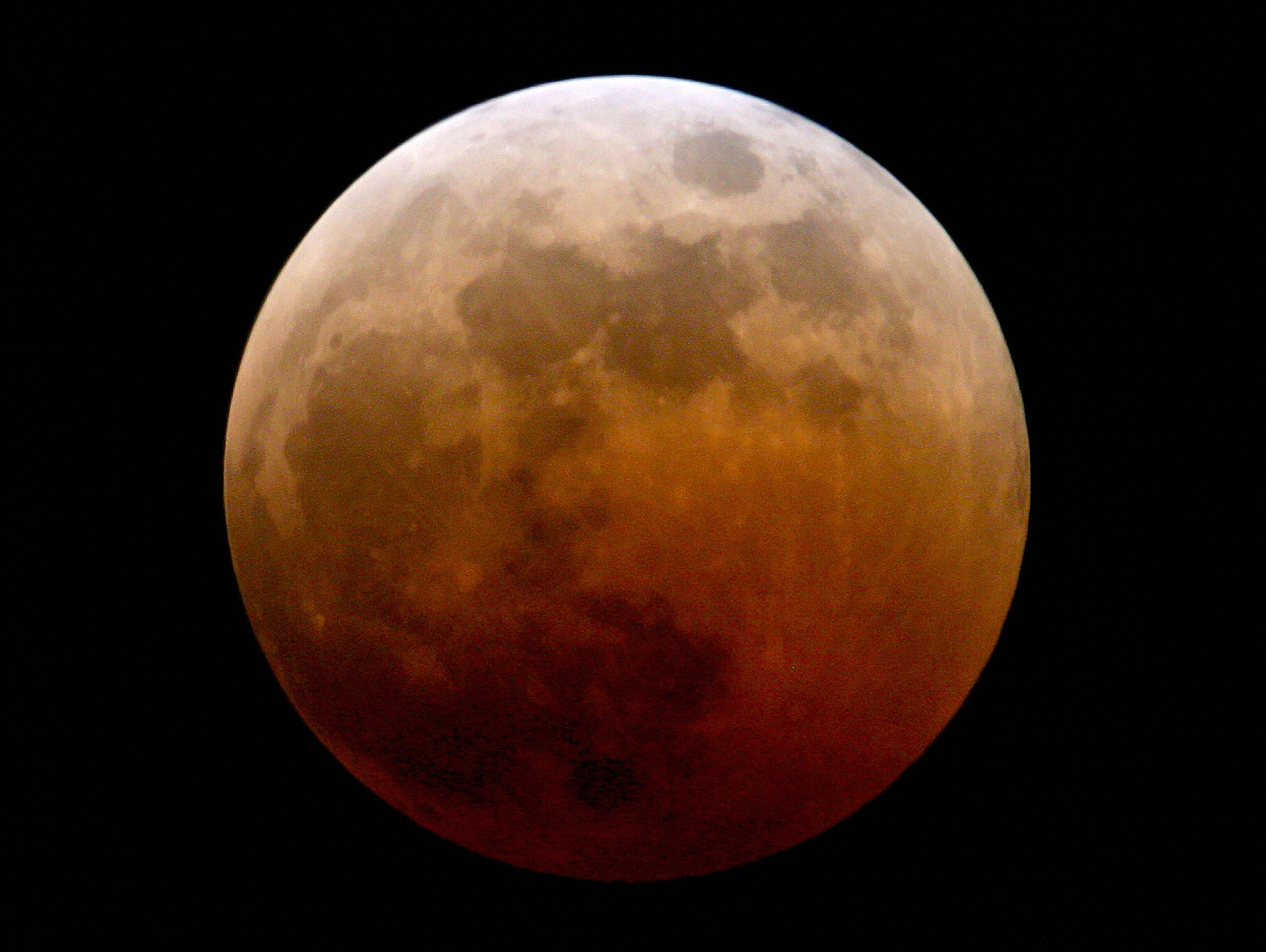 A 'blood Moon' from 2011. The coppery hue is caused by light from the sun refracting through the Earth's atmosphere and striking the surface of the Moon - it's the same mechanism that makes sunsets and sunrises appear red.