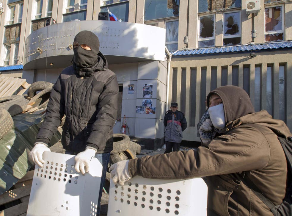 Pro-Russian protesters gather at a barricade outside security service buildings in Luhansk, in eastern Ukraine, on 8 April. Swedish intelligence analysts have identified the situation in eastern Europe as its greatest threat