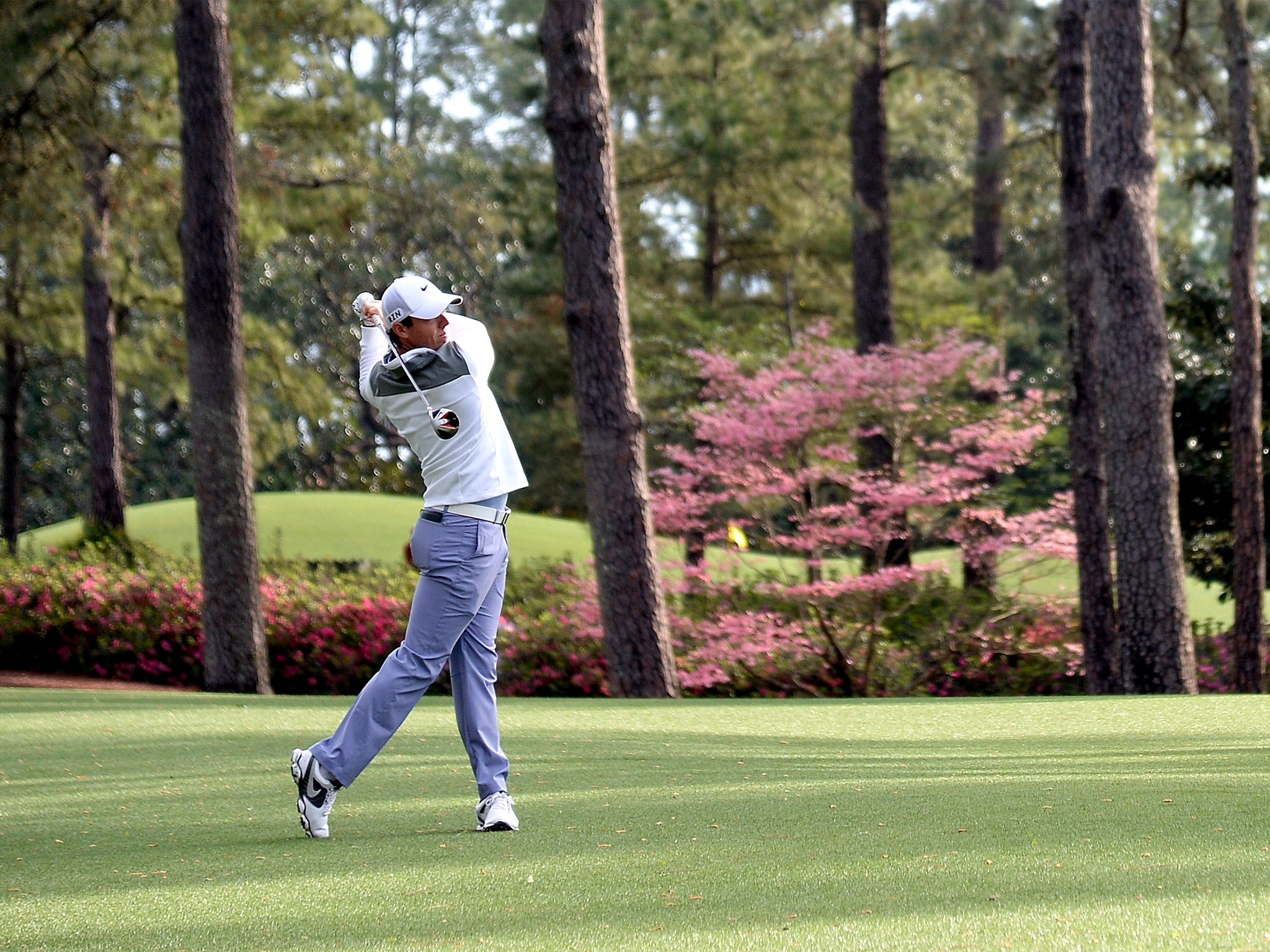 Rory McIlroy watches a drive during his practice round at Augusta