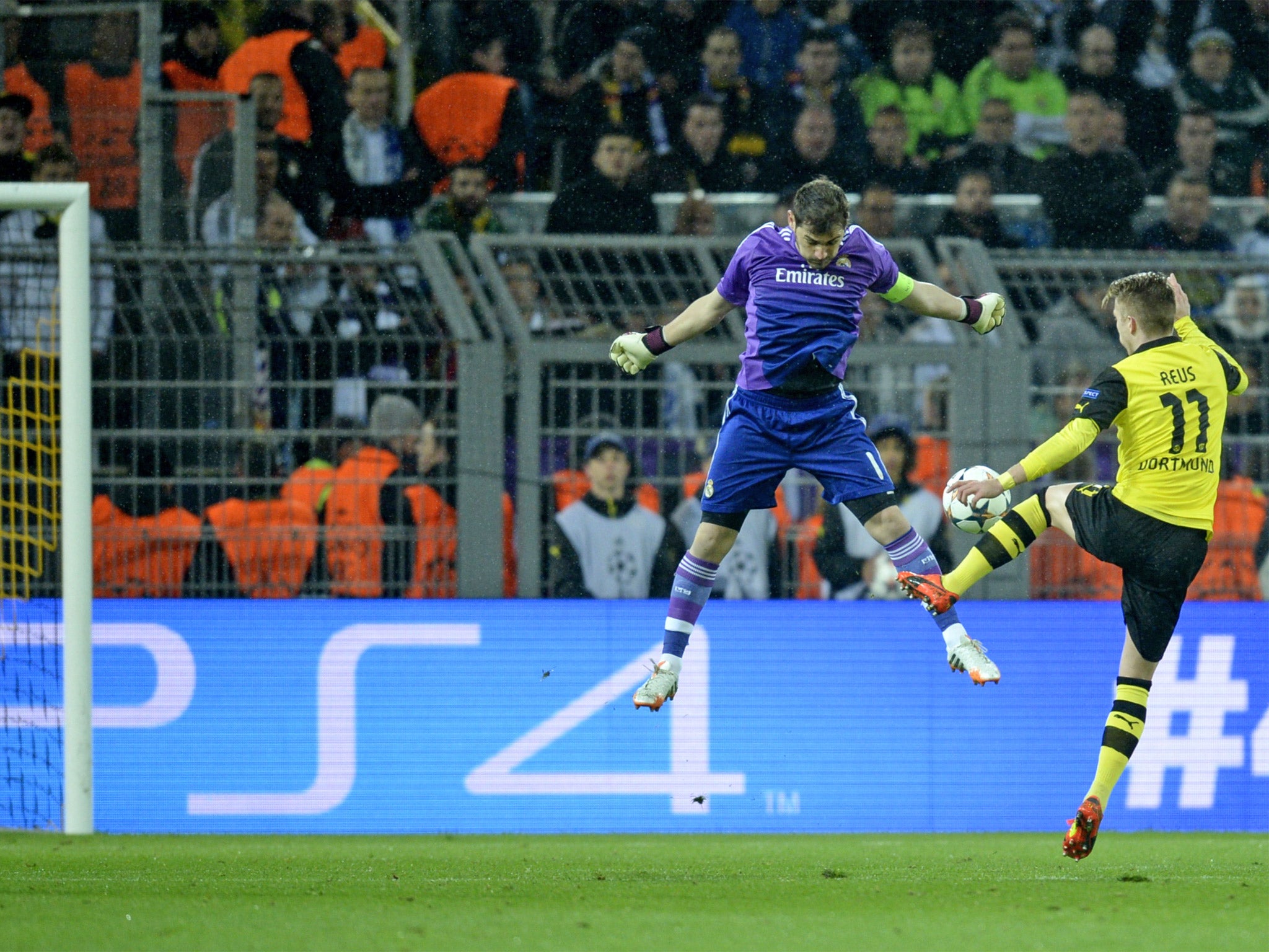 Marco Reus rounds an exposed Iker Casilas to give Dortmund the lead and hope of overturning the tie