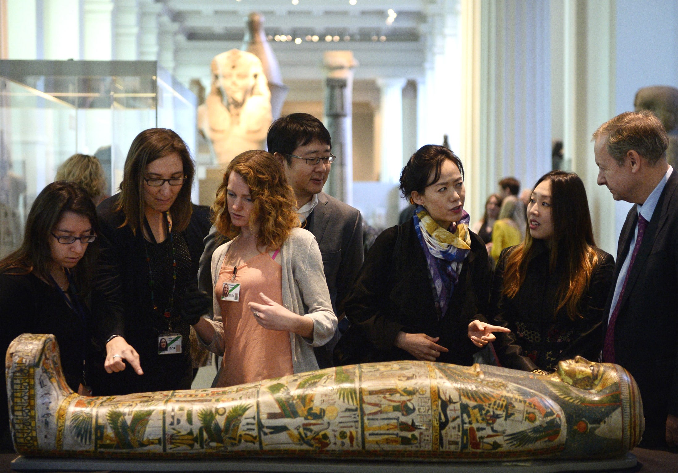 Visitors to the British Museum study the sarcophagus of Tamut