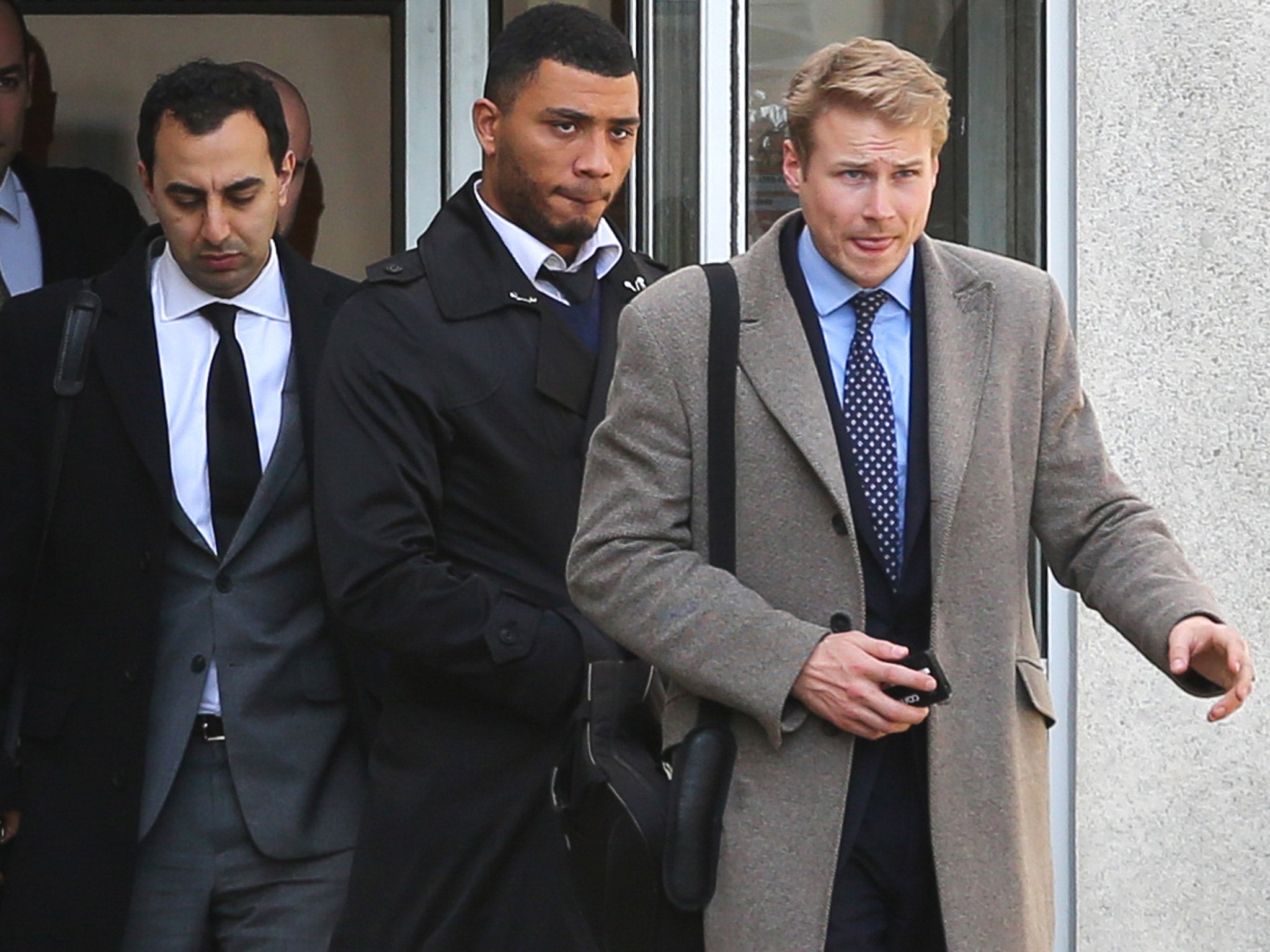 Colin Kazim-Richards (centre) leaves Brighton Magistrates Court in East Sussex
