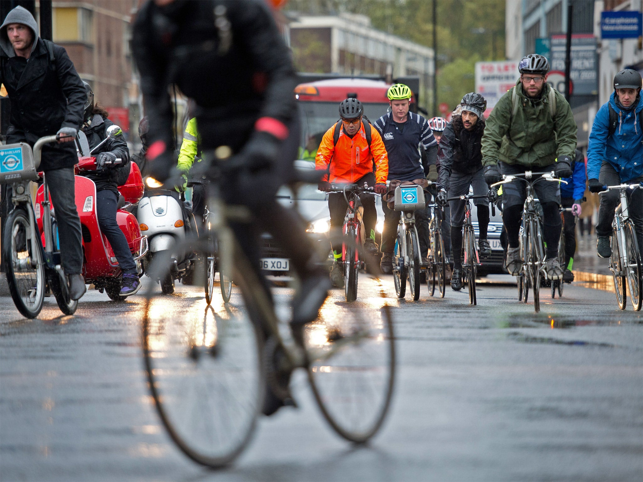 Cyclists ride in front of traffic in central London