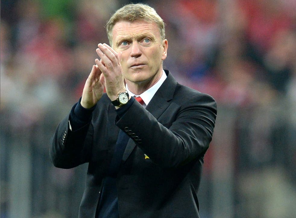 David Moyes applauds the travelling United support following their elimination from Europe