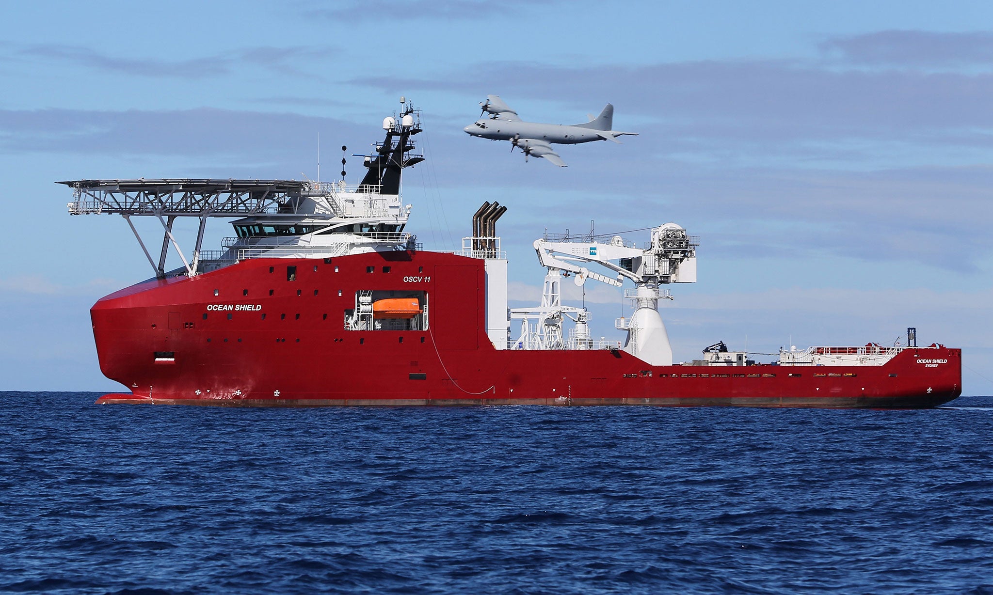A Royal Australian Air Force AP-3C Orion flying past Australian Defence Vessel Ocean Shield, released by the search authorities on 9 April