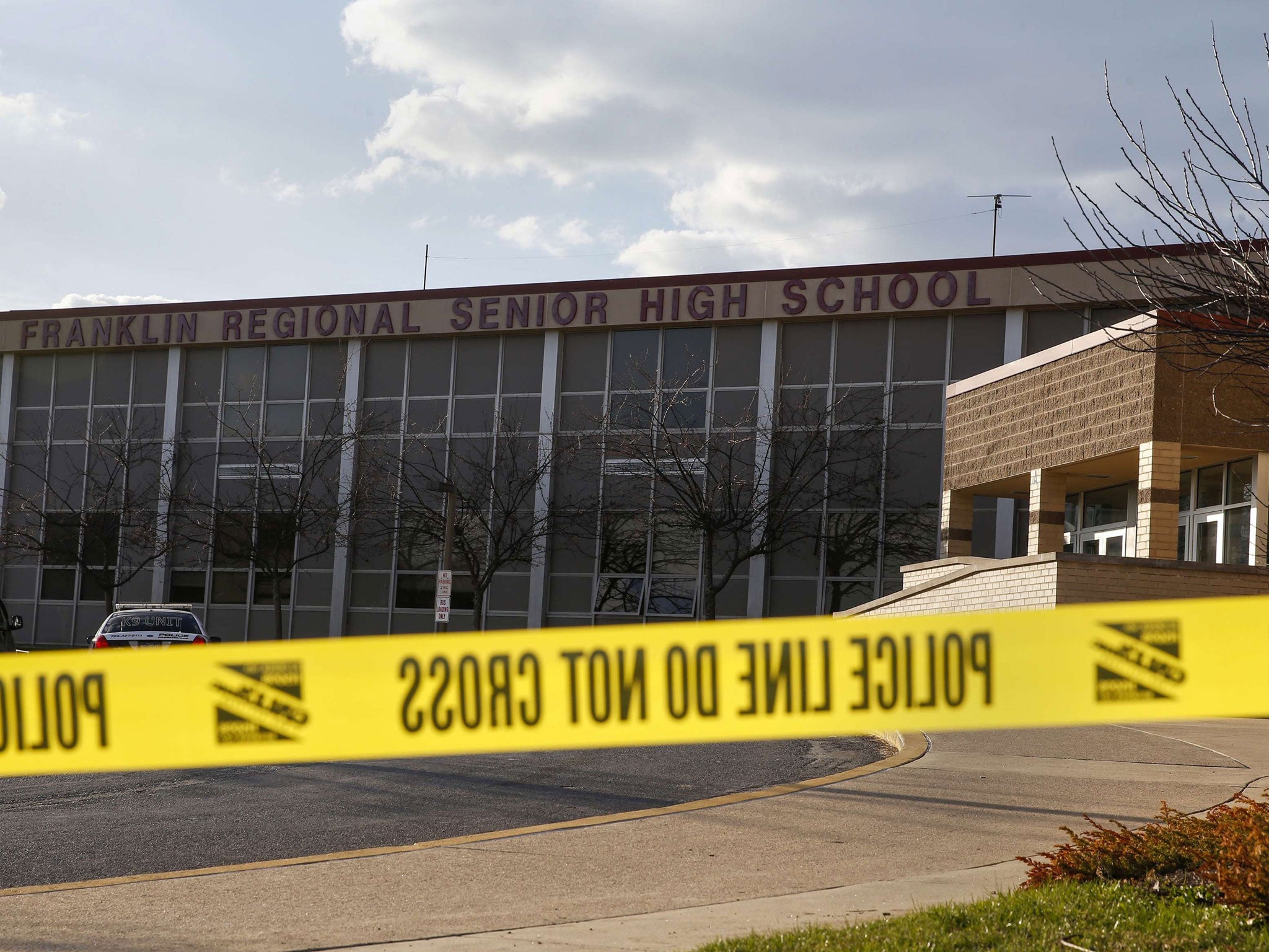 Police tape is seen outside Franklin Regional High School after a series of knife attacks in Murrysville, Pennsylvania (Reuters)