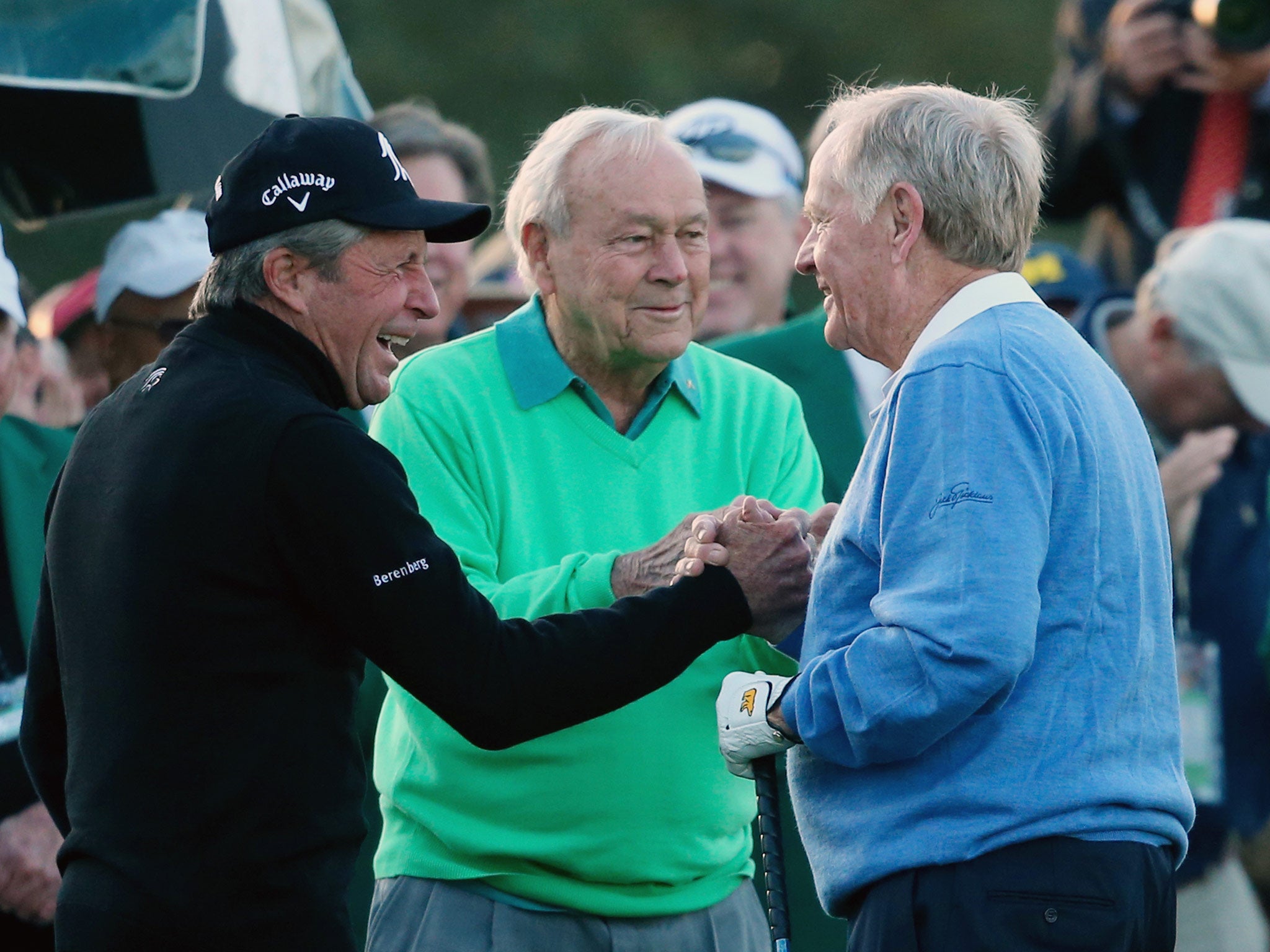 Honorary starters Gary Player, Arnold Palmer and Jack Nicklaus greet each other on the first tee